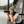Load image into Gallery viewer, Model wearing Nomad Waffle Knit Beanie in Charcoal. Small black tag on front of the beanie reads "Upstate of Mind".