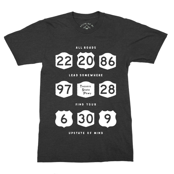 All Roads Tee in Black Heather. Features local Upstate highway signs with text that reads "All Roads Lead Somewhere, Upstate of Mind".