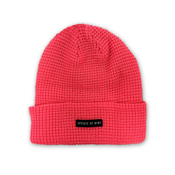 Upstate of Mind Waffle Knit Beanie in Bright Coral. Featuring a black woven label that reads "Upstate Mind" in white text.