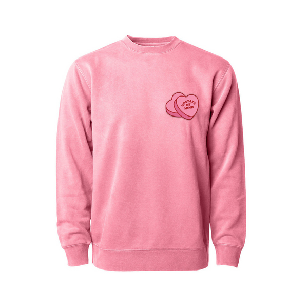 Pink Candy Heart Crewneck by Upstate of Mind with a graphic design of candy hearts that read "Upstate of Mind" on the pocket front.