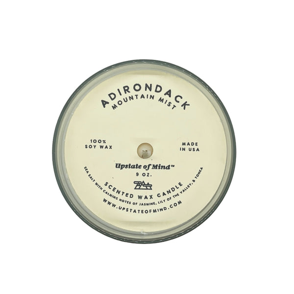 Overhead shot of Adirondack Mountain Mist Candle - 9oz with a white backround.