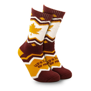 Upstate of Mind Maple Leaf Socks. Colors are burgundy and yellow with chevron stripes, blocks of yellow/burgundy, a yellow maple leaf print, and text that reads "Upstate of Mind".