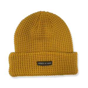 Nomad Waffle Knit Beanie in Marigold. Small black tag on front of the beanie reads "Upstate of Mind".