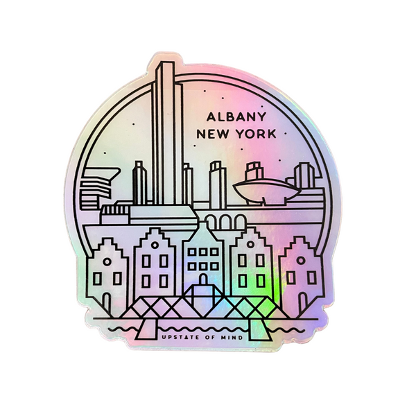 A photo of Albany Skyline Reflective Sticker. It has a shine to it with a rainbow reflection. Artwork is of Albany city with text that reads "Albany New York".