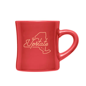 A product photo of The Upstater Ceramic Diner Mug. Mug is red with a tan graphic design of New York State outline with cursive text that reads "Upstate N.Y" in the middle.