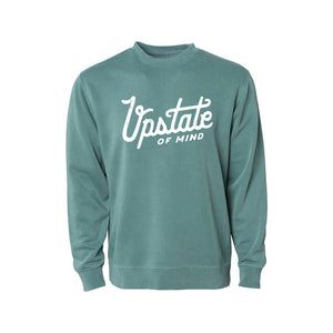 Upstate of Mind - Heritage Script Crewneck - Forest Wash. This crew neck is a super comfy, pigment-dyed fleece that is designed for comfort.  Soft hand feel print on a vintage washed sweatshirt.  Graphic reads "Upstate of Mind" in a large heritage script text.