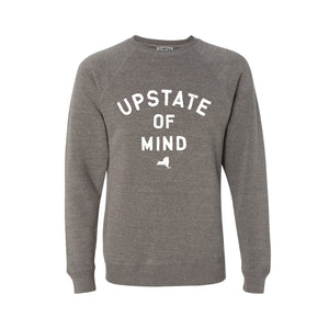 Upstate of Mind Crewneck - Nickel Heather. The Upstate of Mind Crewneck is a super soft polyester/cotton blend fleece. We used the finest inks for soft cozy feel on this graphic fleece. Features text that reads "Upstate of Mind" with a small silhouette of New York State underneath.